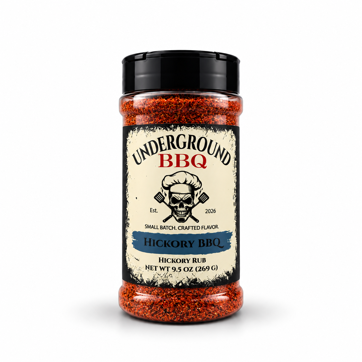 Hickory - Underground BBQ Bottle of Underground BBQ Hickory BBQ rub with skull chef logo and blue “Hickory BBQ” ribbon on label.